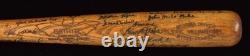 Negro League Hall of Famers and Stars autographed vintage baseball bat. 40 sigs
